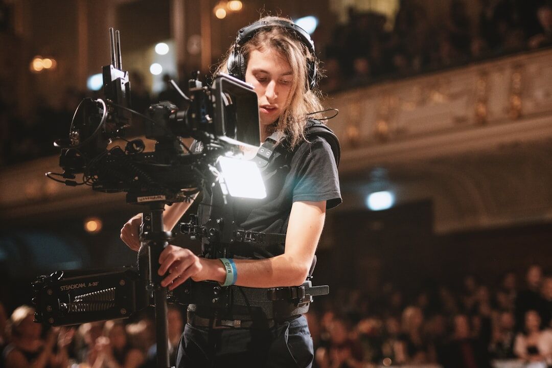 Camera operator using a steadicam rig during a live show