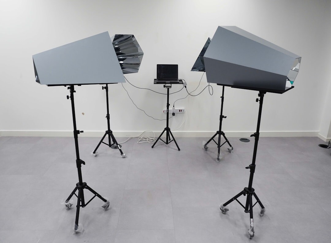 Studio lighting rig with softboxes above a television set